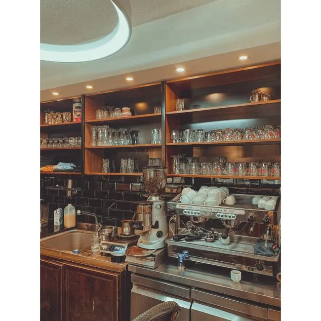 The team preparing coffee behind the counter